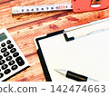 Clipboard, calculator, and measuring tape 142474663
