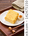 Japanese-style egg dish: Rolled omelet with dashi broth, served with grated daikon radish. Japanese-style egg dish: Rolled omelet with dashi broth, served with grated daikon radish. 142475150