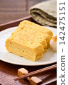 Japanese-style egg dish: Rolled omelet with dashi broth, served with grated daikon radish. Japanese-style egg dish: Rolled omelet with dashi broth, served with grated daikon radish. 142475151