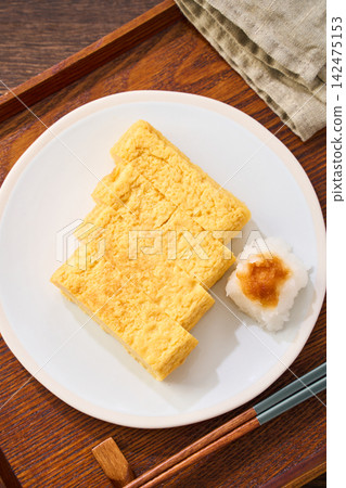 Japanese-style egg dish: Rolled omelet with dashi broth, served with grated daikon radish. Japanese-style egg dish: Rolled omelet with dashi broth, served with grated daikon radish. 142475153