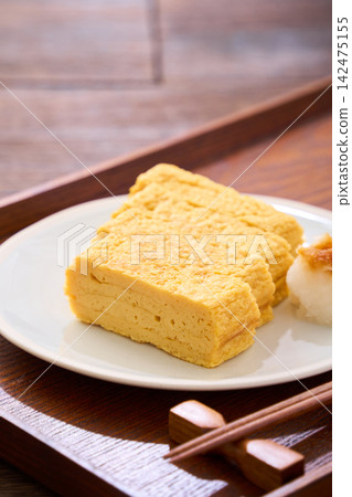 Japanese-style egg dish: Rolled omelet with dashi broth, served with grated daikon radish. Japanese-style egg dish: Rolled omelet with dashi broth, served with grated daikon radish. 142475155