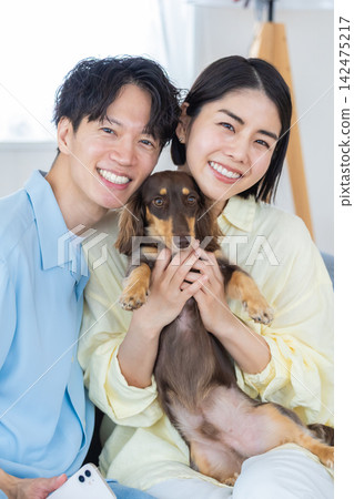 Family Life with a Dog: A Portrait of a Miniature Dachshund and its Owner Family Life with a Dog: A Portrait of a Miniature Dachshund and its Owner 142475217