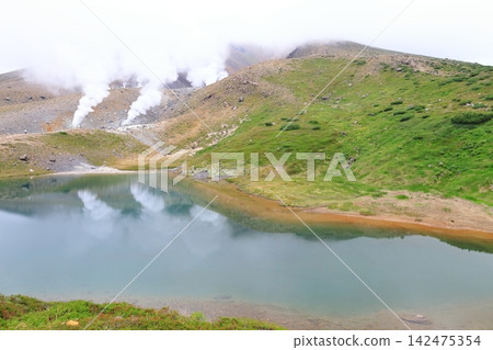 Viewing the volcanic plume from Sugatami Pond at the foot of Mt. Asahidake in the Daisetsuzan mountain range of Hokkaido. Viewing the volcanic plume from Sugatami Pond at the foot of Mt. Asahidake in the Daisetsuzan mountain range of Hokkaido. 142475354