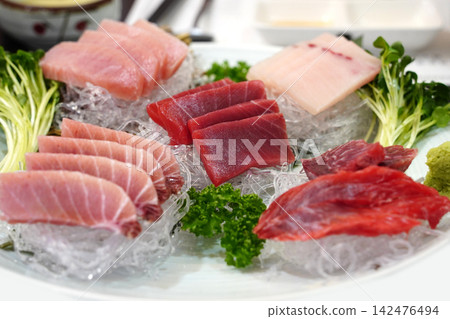Premium Assorted Tuna Sashimi Slices Served with Wasabi and Radish Sprouts Premium Assorted Tuna Sashimi Slices Served with Wasabi and Radish Sprouts 142476494