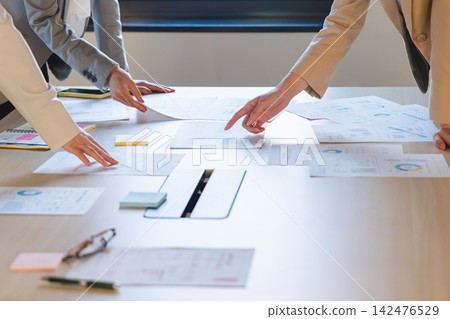 Hands spread out as they hold a meeting Hands spread out as they hold a meeting 142476529