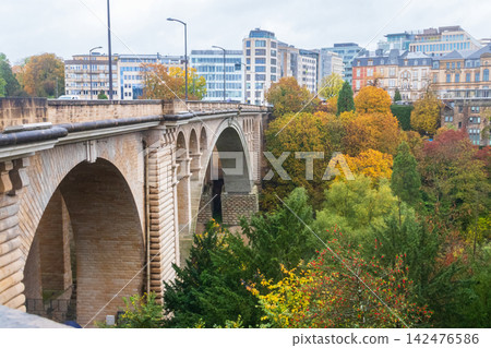 Scenic autumn view of historic Adolphe Bridge in Luxembourg with beautiful fall foliage Scenic autumn view of historic Adolphe Bridge in Luxembourg with beautiful fall foliage 142476586