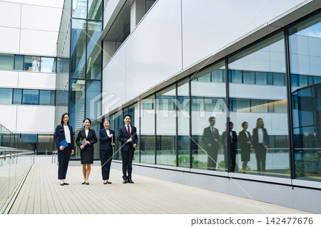 A group of business people standing side by side. Teamwork, colleagues, talent, unity, work, company, business, recruitment, management A group of business people standing side by side. Teamwork, colleagues, talent, unity, work, company, business, recruitment, management 142477676