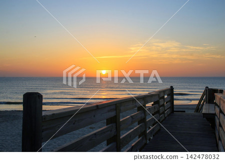 Sunrise Over Corolla Beach in North Carolina With Wooden Walkway Sunrise Over Corolla Beach in North Carolina With Wooden Walkway 142478032