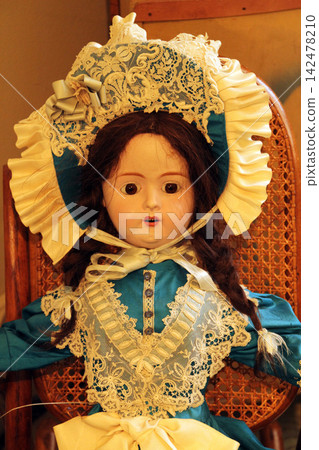 Antique doll toy with a dress Antique doll toy with a dress 142478210