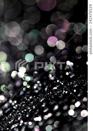 Bokeh sparkly festive black gothic glitter style background sexy fishnet tights Bokeh sparkly festive black gothic glitter style background sexy fishnet tights 142478529