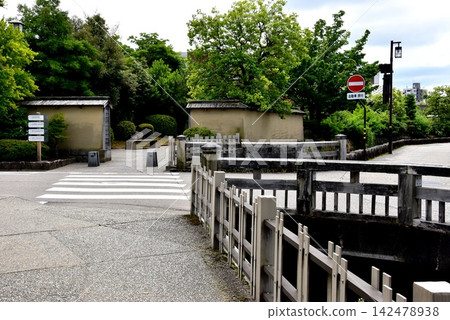 Kanazawa City: Ohnosho Waterway, Nagamachi Rokunobashi Bridge, walking path, tourist information sign, and deep greenery. Kanazawa City: Ohnosho Waterway, Nagamachi Rokunobashi Bridge, walking path, tourist information sign, and deep greenery. 142478938