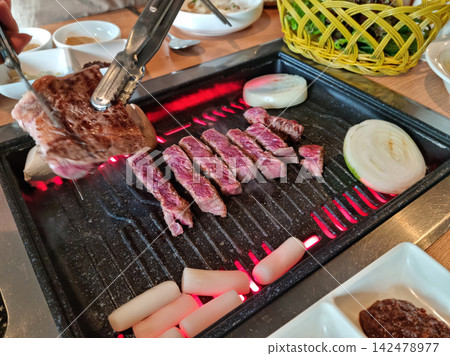 Beef cooked on a fire Beef cooked on a fire 142478977