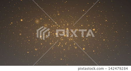 Golden particles scattering on a dark background, forming a beautiful abstract light effect 142479284