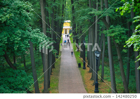 Colorful Monument at the End of a Forest Walkway Colorful Monument at the End of a Forest Walkway 142480250