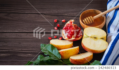 Rosh Hashanah Jewish New Year holiday with pomegranate, apples, honey on the wooden background Rosh Hashanah Jewish New Year holiday with pomegranate, apples, honey on the wooden background 142480313