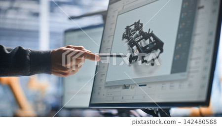 Engineer Reviewing Robotic System Design and Technical Schematics on Interactive Digital Display Engineer Reviewing Robotic System Design and Technical Schematics on Interactive Digital Display 142480588
