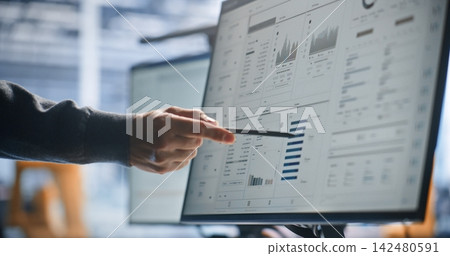 Engineer Reviewing Robotic System Design and Technical Schematics on Interactive Digital Display Engineer Reviewing Robotic System Design and Technical Schematics on Interactive Digital Display 142480591