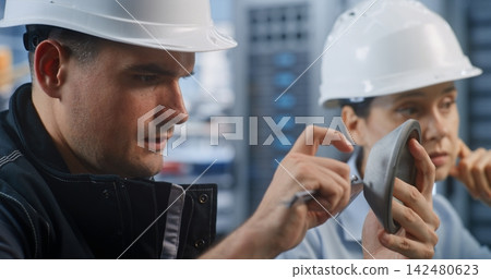 Industrial Engineers Analyzing Part Tolerances and Solving Design Errors Industrial Engineers Analyzing Part Tolerances and Solving Design Errors 142480623