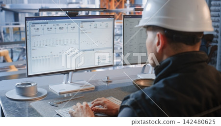 Industrial Specialist Monitoring Conveyor Robots from Factory Glass Office Industrial Specialist Monitoring Conveyor Robots from Factory Glass Office 142480625