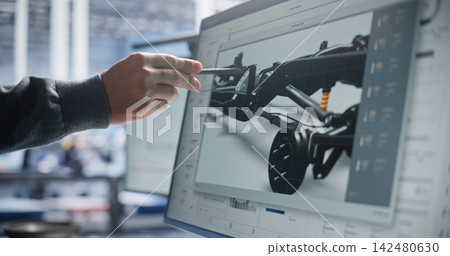Specialist Inspecting Automotive Frame Blueprint with Stylus Specialist Inspecting Automotive Frame Blueprint with Stylus 142480630