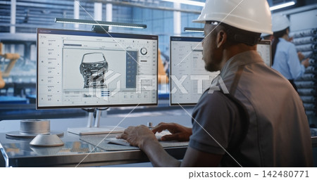 Engineer Modeling Car Chassis Components in Smart Factory Engineer Modeling Car Chassis Components in Smart Factory 142480771