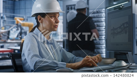 Female Engineer Designing 3D Vehicle Chassis Model on Factory PC Screen Female Engineer Designing 3D Vehicle Chassis Model on Factory PC Screen 142480824