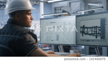 Industrial Specialist Supervising Factory Telemetry Data on Dual Monitors Industrial Specialist Supervising Factory Telemetry Data on Dual Monitors 142480870