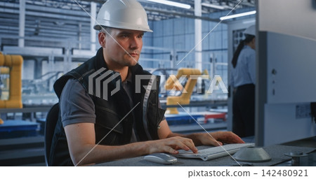Engineer Measuring Component with Caliper near Server Cabinet in Smart Plant 142480921
