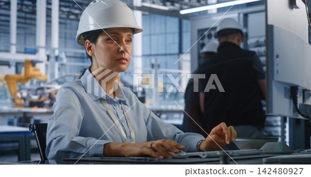 Industrial Engineer Inspecting assembly of automotive frames on Display Industrial Engineer Inspecting assembly of automotive frames on Display 142480927