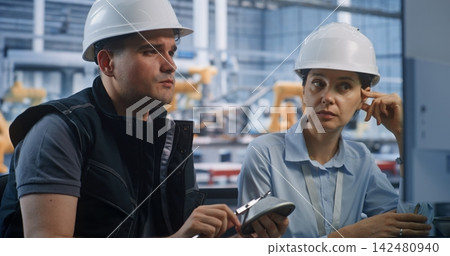 Factory Engineers Comparing Caliper Measurements with CAD Data on Screen Factory Engineers Comparing Caliper Measurements with CAD Data on Screen 142480940