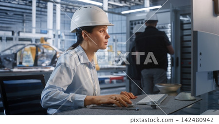 Female Engineer Measuring Metal Component with Caliper near Server Cabinet Female Engineer Measuring Metal Component with Caliper near Server Cabinet 142480942