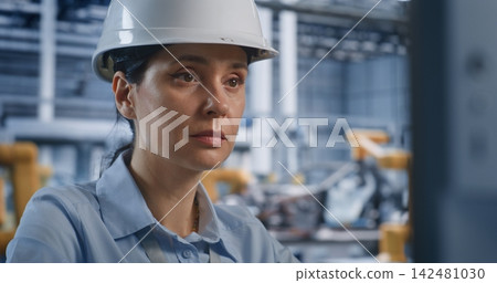 Female Specialist Managing Modern Industrial Software at Workstation Female Specialist Managing Modern Industrial Software at Workstation 142481030