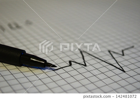 Black Pen and Pencil on Graph Paper with Line Drawing Black Pen and Pencil on Graph Paper with Line Drawing 142481072