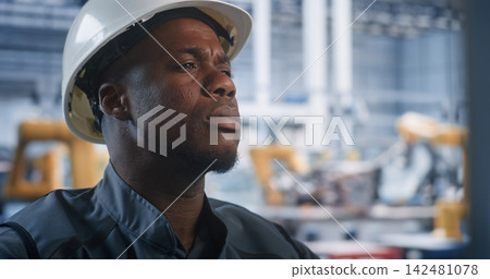 Operator Supervising Robotic Assembly in Smart Plant Operator Supervising Robotic Assembly in Smart Plant 142481078