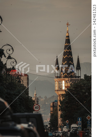 Gothic Style Tower Above Urban Street at Golden Hour Gothic Style Tower Above Urban Street at Golden Hour 142481323