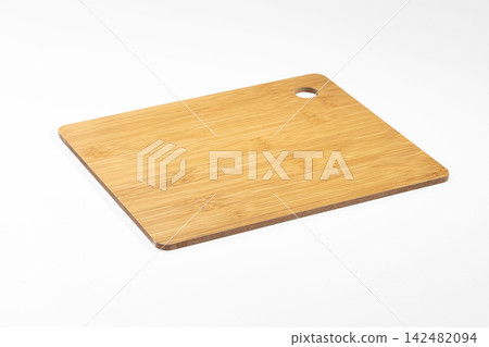 Bamboo cutting board with hole for hanging isolated on white background Bamboo cutting board with hole for hanging isolated on white background 142482094