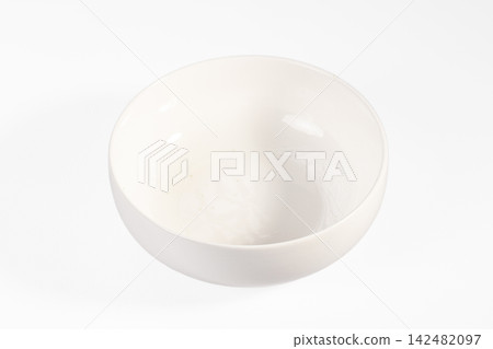 Empty white ceramic bowl on white background Empty white ceramic bowl on white background 142482097