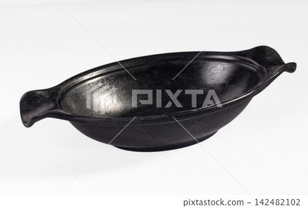 Rustic black ceramic serving bowl with handles isolated on white Rustic black ceramic serving bowl with handles isolated on white 142482102