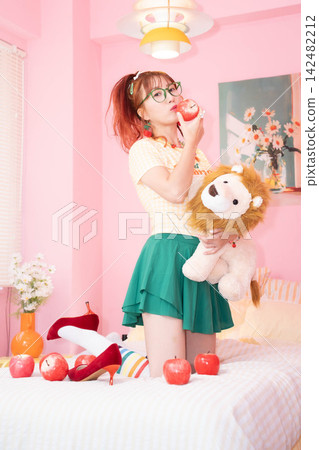 A girl holding a stuffed animal A girl holding a stuffed animal 142482212