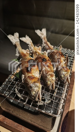 Salt-grilled sweetfish, cooked over charcoal for a fragrant finish. Salt-grilled sweetfish, cooked over charcoal for a fragrant finish. 142483099