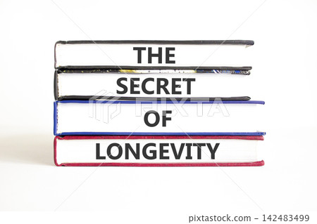 The secret of longevity words symbol. Concept words The secret of longevity on beautiful books. Beautiful white background. Psychological medical the secret of longevity concept. Copy space. The secret of longevity words symbol. Concept words The secret of longevity on beautiful books. Beautiful white background. Psychological medical the secret of longevity concept. Copy space. 142483499