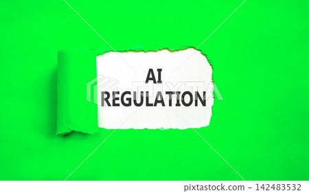 AI regulation symbol. Concept words AI artificial intelligence regulation on beautiful white paper. Beautiful green background. Business AI artificial intelligence regulation concept. Copy space. AI regulation symbol. Concept words AI artificial intelligence regulation on beautiful white paper. Beautiful green background. Business AI artificial intelligence regulation concept. Copy space. 142483532