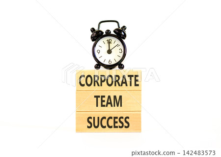 Corporate team success words symbol. Concept words Corporate team success on beautiful wooden blocks. Beautiful white background. Black alarm clock. Business corporate team success concept Copy space Corporate team success words symbol. Concept words Corporate team success on beautiful wooden blocks. Beautiful white background. Black alarm clock. Business corporate team success concept Copy space 142483573