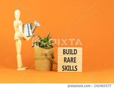 Build rare skills words symbol. Concept words Build rare skills on beautiful wooden blocks. Beautiful orange background. Businessman model. Business and build rare skills concept. Copy space. Build rare skills words symbol. Concept words Build rare skills on beautiful wooden blocks. Beautiful orange background. Businessman model. Business and build rare skills concept. Copy space. 142483577