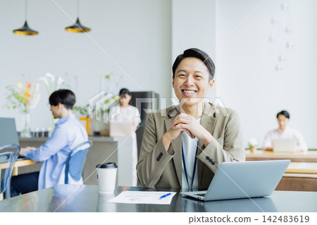 Middle-class engineer working in an office 142483619