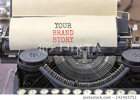 Branding and your brand story symbol. Concept words Your brand story typed on beautiful old retro typewriter. Beautiful white background. Business branding your brand story concept. Copy space. Branding and your brand story symbol. Concept words Your brand story typed on beautiful old retro typewriter. Beautiful white background. Business branding your brand story concept. Copy space. 142483751