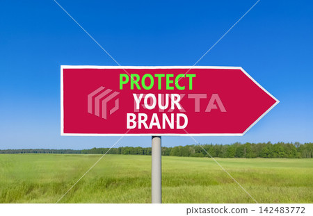 Protect your brand words symbol. Concept words Protect your brand on beautiful red road sign. Beautiful blue sky green grass background. Business and protect your brand concept. Copy space. Protect your brand words symbol. Concept words Protect your brand on beautiful red road sign. Beautiful blue sky green grass background. Business and protect your brand concept. Copy space. 142483772