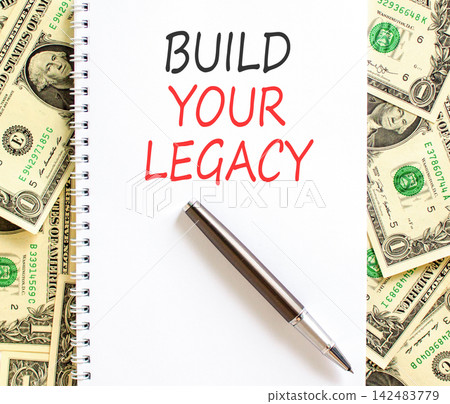 Build your legacy words symbol. Concept words Build your legacy on beautiful white note. Beautiful dollar bills background. Business build your legacy concept. Copy space. Build your legacy words symbol. Concept words Build your legacy on beautiful white note. Beautiful dollar bills background. Business build your legacy concept. Copy space. 142483779