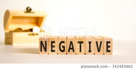 Negative word symbol. Concept word Negative on beautiful wooden blocks. Beautiful white background. Beautiful wooden chest with coins. Business support help negative word concept. Copy space. Negative word symbol. Concept word Negative on beautiful wooden blocks. Beautiful white background. Beautiful wooden chest with coins. Business support help negative word concept. Copy space. 142483802