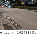 Road markings: "Bicycle lane" (nighttime) 142483861